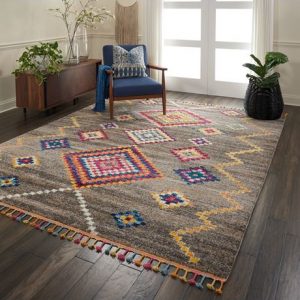 grey and multicolour rug with tassels